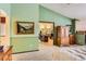 Main bedroom with a view into an adjacent office and a large wooden armoire at 6575 S Webster St, Littleton, CO 80123