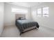 Cozy bedroom featuring carpet, a modern bed, and plenty of natural light at 1953 W 47Th Ave, Denver, CO 80211
