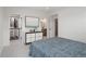 Bedroom with large closet, modern dresser, and an ensuite bathroom at 1953 W 47Th Ave, Denver, CO 80211