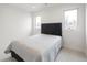 Bright bedroom with a modern bed, plush carpet, and ample natural light at 1953 W 47Th Ave, Denver, CO 80211
