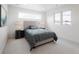 Bright bedroom with large windows, plush carpeting, and a comfortable, stylish bed frame at 1953 W 47Th Ave, Denver, CO 80211