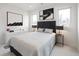Serene bedroom featuring neutral decor, hardwood floors, and ample natural light at 1953 W 47Th Ave, Denver, CO 80211