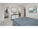 Stylish bedroom with a modern dresser, artistic decor, and an open closet for ample storage at 1953 W 47Th Ave, Denver, CO 80211