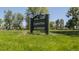 A large green Chaffee Park sign surrounded by a well-maintained lawn and mature trees in a serene, Gathering-friendly environment at 1953 W 47Th Ave, Denver, CO 80211