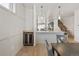 Dining area next to the kitchen featuring a wine cooler and decorative wainscotting on the walls at 1953 W 47Th Ave, Denver, CO 80211