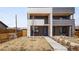 Contemporary home features a multi-level design with a combination of brick and sleek siding, plus neat landscaping at 1953 W 47Th Ave, Denver, CO 80211