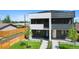 Inviting townhome with modern design, manicured lawn, and a welcoming walkway at 1953 W 47Th Ave, Denver, CO 80211