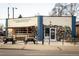 Colorful mural on Huckleberry Roasters exterior with outdoor seating at 1953 W 47Th Ave, Denver, CO 80211