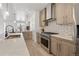 Well-equipped kitchen with quartz countertops, stainless steel appliances, and modern cabinetry at 1953 W 47Th Ave, Denver, CO 80211