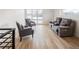 Open-concept living room features hardwood floors, neutral walls, and large sliding glass doors to the outdoor living space at 1953 W 47Th Ave, Denver, CO 80211