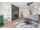 Inviting living room featuring a modern fireplace and stylish decor at 1953 W 47Th Ave, Denver, CO 80211