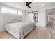 The main bedroom features a sliding barn door to the bath and a ceiling fan at 1953 W 47Th Ave, Denver, CO 80211