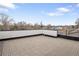 Expansive rooftop deck with tiled flooring and stylish black railings, perfect for outdoor entertaining at 1953 W 47Th Ave, Denver, CO 80211