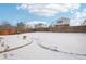 Large backyard covered in snow with a wooden fence at 20242 E Lasalle Pl, Aurora, CO 80013