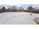 Large backyard covered in snow with a wooden fence at 20242 E Lasalle Pl, Aurora, CO 80013