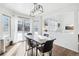 Dining area with wooden table, black chairs, and access to backyard at 20242 E Lasalle Pl, Aurora, CO 80013