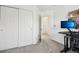 A light-filled hallway with carpet flooring and access to other rooms at 20242 E Lasalle Pl, Aurora, CO 80013