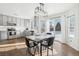 Modern kitchen with gray cabinets, stainless steel appliances, and hardwood floors at 20242 E Lasalle Pl, Aurora, CO 80013