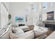 Living room with L-shaped sofa, fireplace, and high ceilings at 20242 E Lasalle Pl, Aurora, CO 80013