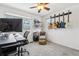 Home office space with a desk, chair and guitar wall at 20242 E Lasalle Pl, Aurora, CO 80013