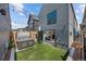 A backyard with a hot tub and opening doors to the living room at 3409 Navajo St, Denver, CO 80211