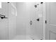 Modern tiled shower with glass door and rainfall shower head at 3409 Navajo St, Denver, CO 80211