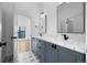 Modern bathroom with stylish tile flooring and marble countertops at 3409 Navajo St, Denver, CO 80211