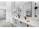 This modern bathroom has a double vanity, walk-in shower, and sleek black accents at 3409 Navajo St, Denver, CO 80211