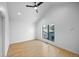 Bright bedroom featuring hardwood floors, modern ceiling fan and large window at 3409 Navajo St, Denver, CO 80211