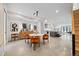 Open-concept living space featuring a modern dining area, kitchen, and staircase, offering seamless flow at 3409 Navajo St, Denver, CO 80211