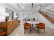 Open-concept dining area with modern lighting, stylish furniture, and seamless flow to the kitchen at 3409 Navajo St, Denver, CO 80211