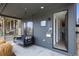 Charming covered front porch featuring a porch swing, sleek siding and contemporary house number at 3409 Navajo St, Denver, CO 80211