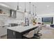Open concept kitchen boasts a large island with seating and stainless steel appliances at 3409 Navajo St, Denver, CO 80211