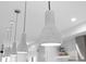 Pendant lighting in a modern kitchen adds a stylish touch to the bright and open space at 3409 Navajo St, Denver, CO 80211