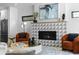 Cozy living room with a modern fireplace, stylish decor, and comfortable seating with great natural light at 3409 Navajo St, Denver, CO 80211