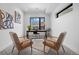 A bright office space with modern decor, a large window, and two comfortable chairs at 3409 Navajo St, Denver, CO 80211
