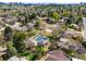 An aerial view of the community amenities including a pool, tennis courts, and green spaces at 6389 S Monaco Ct, Centennial, CO 80111