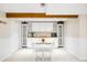 Finished basement featuring a dining area with a white table and chairs and lots of cabinets at 6389 S Monaco Ct, Centennial, CO 80111