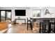Basement bar area featuring stone accents, bar seating, a TV, and a cozy seating area at 6389 S Monaco Ct, Centennial, CO 80111