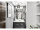 Stylish bathroom with gray cabinets, double sinks and contemporary lighting fixture at 6389 S Monaco Ct, Centennial, CO 80111