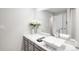 Modern bathroom with a marble countertop, stylish sink, and a large mirror at 6389 S Monaco Ct, Centennial, CO 80111