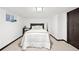 Modern bedroom with a comfortable bed, plush bedding, and a minimalist design at 6389 S Monaco Ct, Centennial, CO 80111