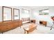 Bright bedroom featuring hardwood floors, contemporary furnishings, and large windows at 6389 S Monaco Ct, Centennial, CO 80111