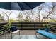 Cozy deck space with lounge chair, side table, and a beautiful view of the outdoors at 6389 S Monaco Ct, Centennial, CO 80111