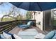 Relaxing deck area with seating and shade umbrella, perfect for enjoying the outdoors at 6389 S Monaco Ct, Centennial, CO 80111