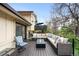 Outdoor deck space with comfortable seating, fire pit, and scenic views at 6389 S Monaco Ct, Centennial, CO 80111