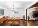 Dining room with wood floors and modern light fixture at 6389 S Monaco Ct, Centennial, CO 80111