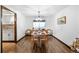Dining room with wood floors and modern light fixture at 6389 S Monaco Ct, Centennial, CO 80111