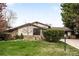 Charming home with stone accents, manicured lawn, and mature landscaping at 6389 S Monaco Ct, Centennial, CO 80111