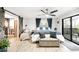 Bright bedroom features an accent wall, barn door, and sliding glass door to the outside at 6389 S Monaco Ct, Centennial, CO 80111